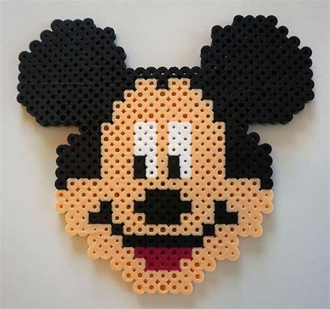 My boyfriend and I have been <strong>perler</strong>-ing for a while now and we started a collection on the wall. . Mickey mouse perler bead
